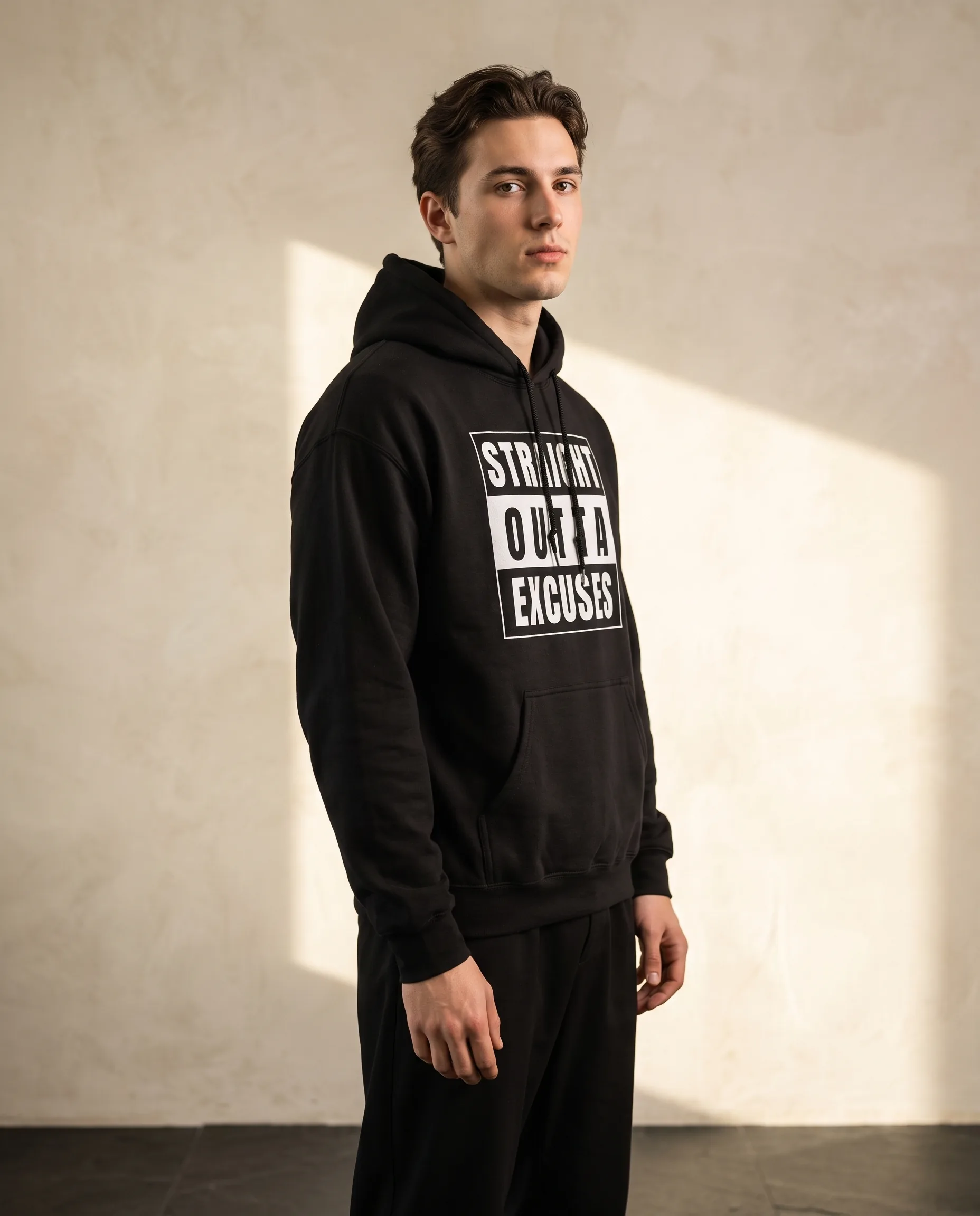 Man wearing the Straight Outta Excuses hoodie from the men’s collection